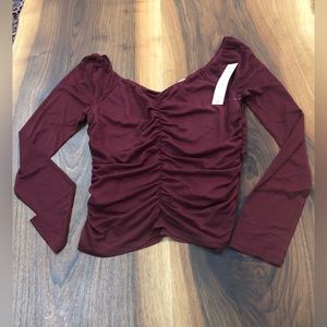 Cranberry smocked long sleeve top by Crave Fame